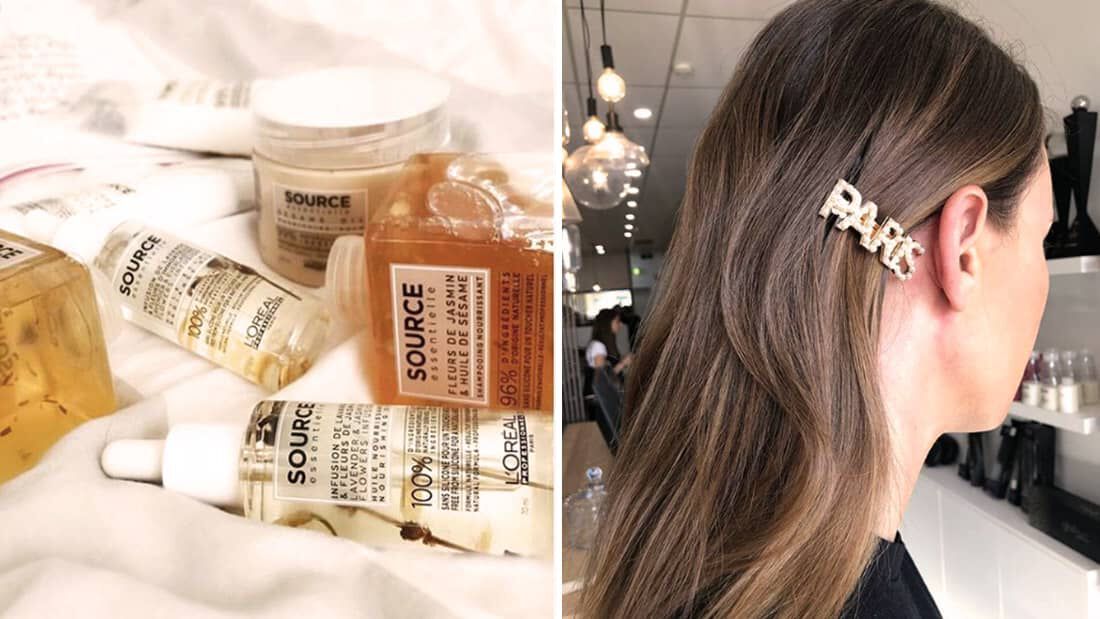 A collection of SOURCE hair products displayed on a surface alongside a close-up of a person’s hair featuring a decorative hair clip that spells "PARK."